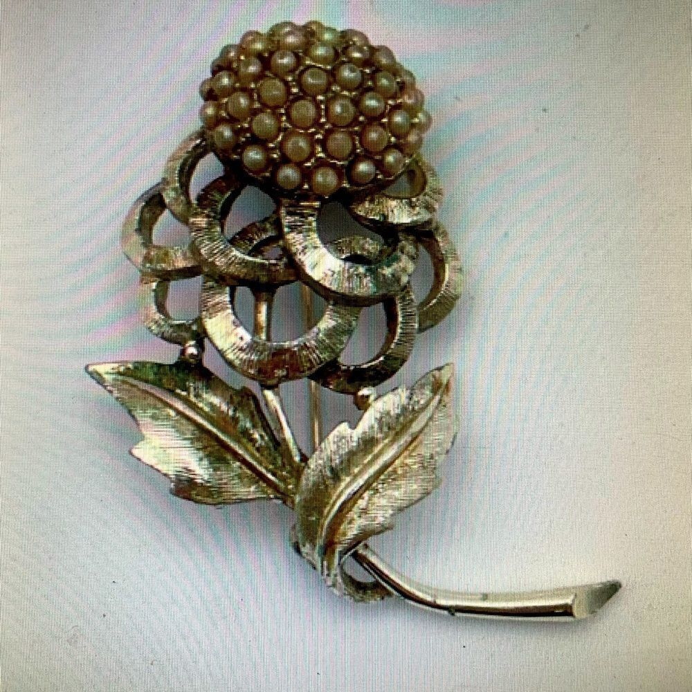 Lovely antique brooch, gold finish with seed pearls . Definitely shows it’s age